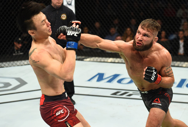 Jeremy Stephens punches Doo Ho Choi during their fight at UFC Fight Night 124 in St. Louis on January 14, 2018. (Photo: UFC Facebook)